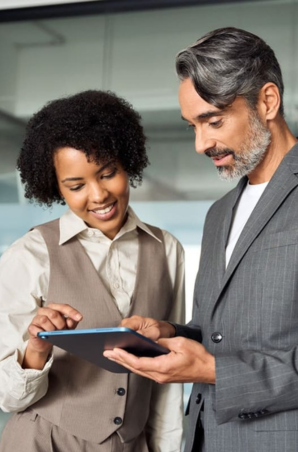 Couple working on a tablet at the office