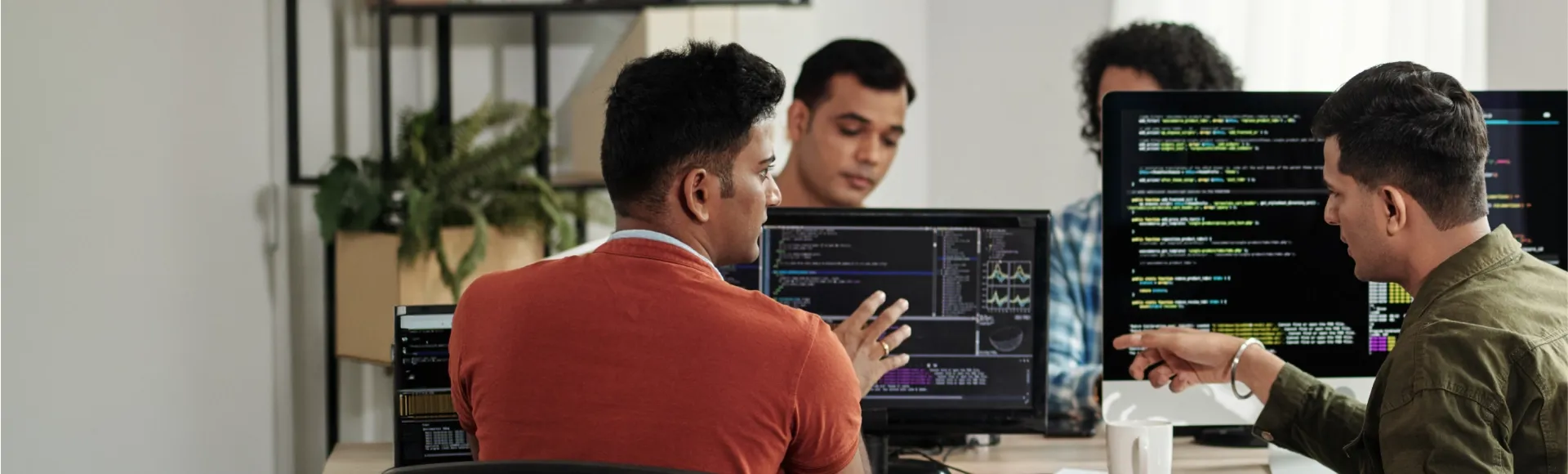 Software developers working on code for agentic AI development.