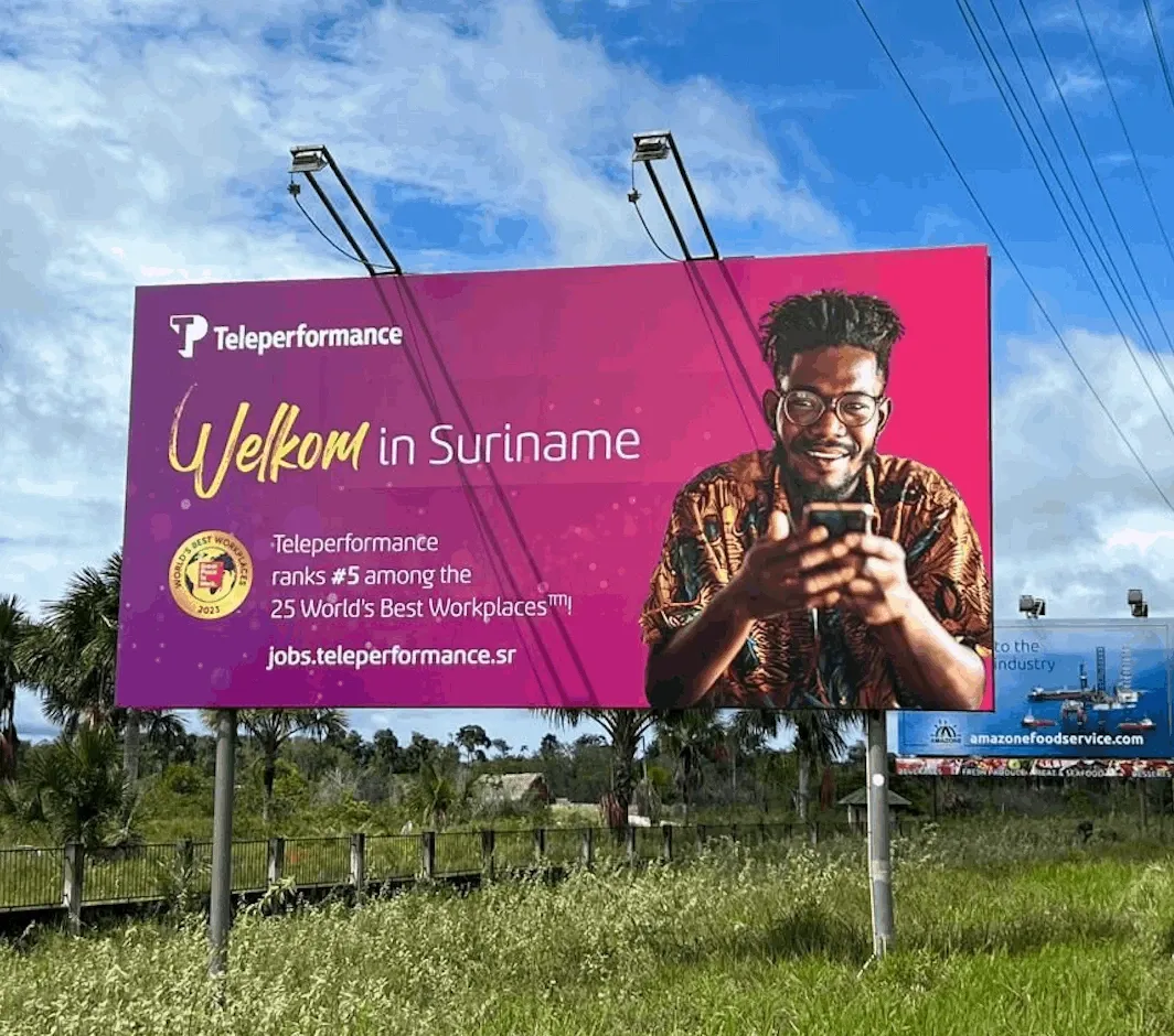 Pink TP outdoor with a guy holding a phone.