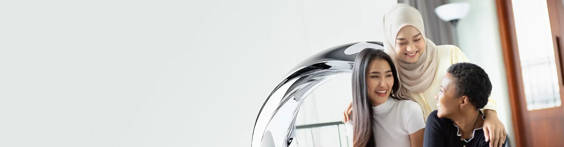 Three colleagues smiling together, highlighting job opportunities at TP.