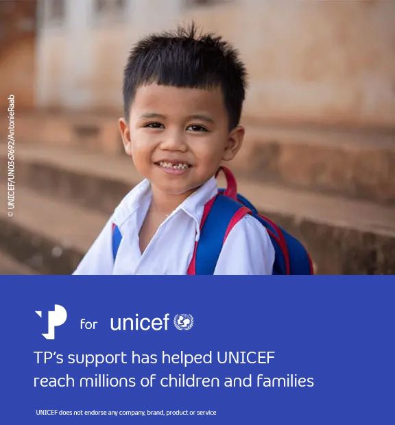 Smiling young boy, next to a blue UNICEF banner with the message supporting a brighter tomorrow.