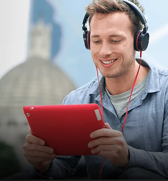 Man listening to music on his tablet