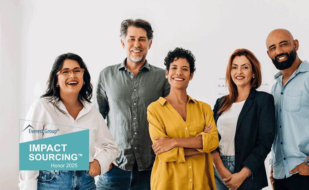 Diverse group of smiling employees with TP’s Impact Sourcing award from Everest Group.