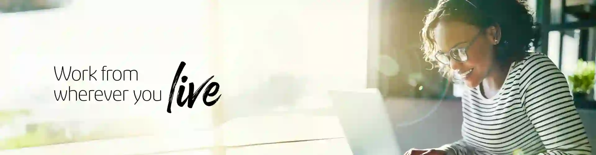 Smiling woman working on her laptop