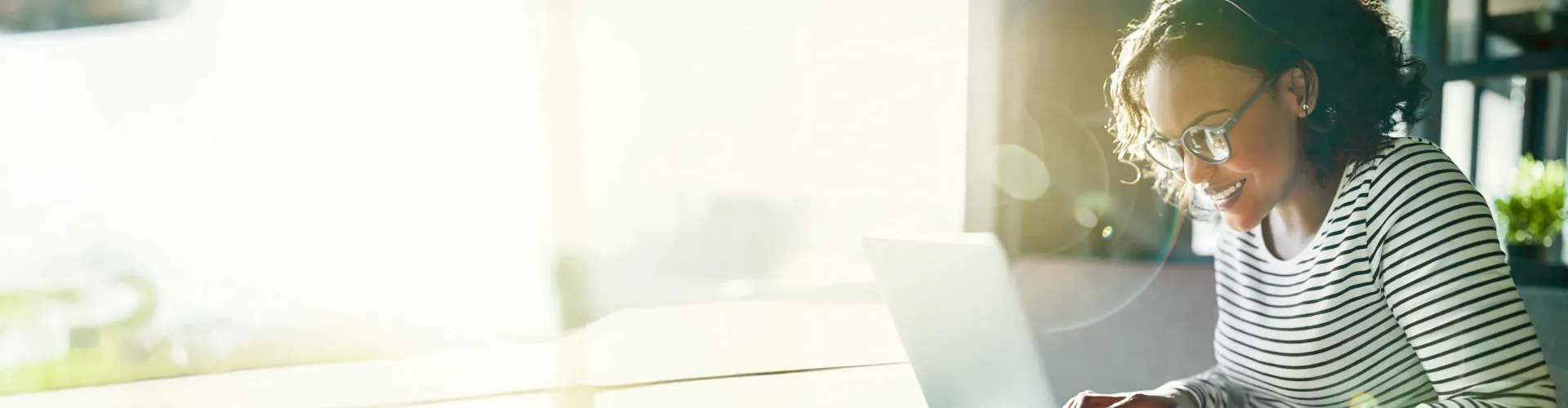 Smiling woman working on her laptop