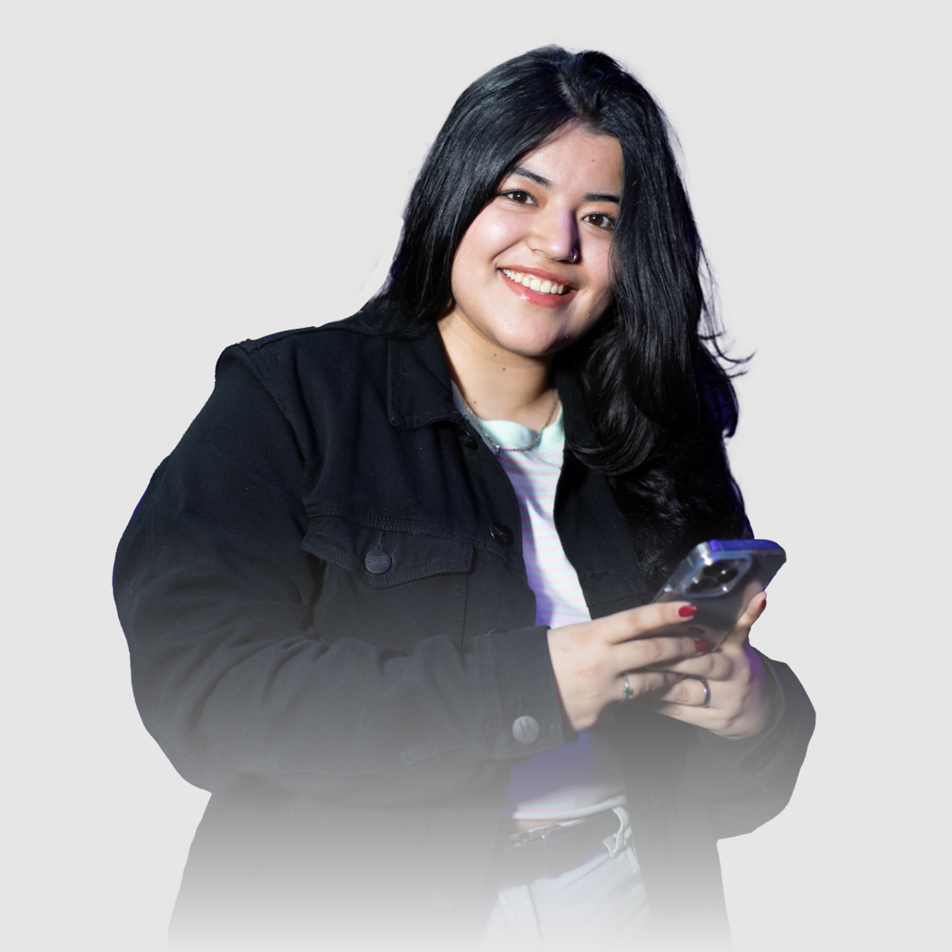 Smiling woman in black jacket holding smartphone