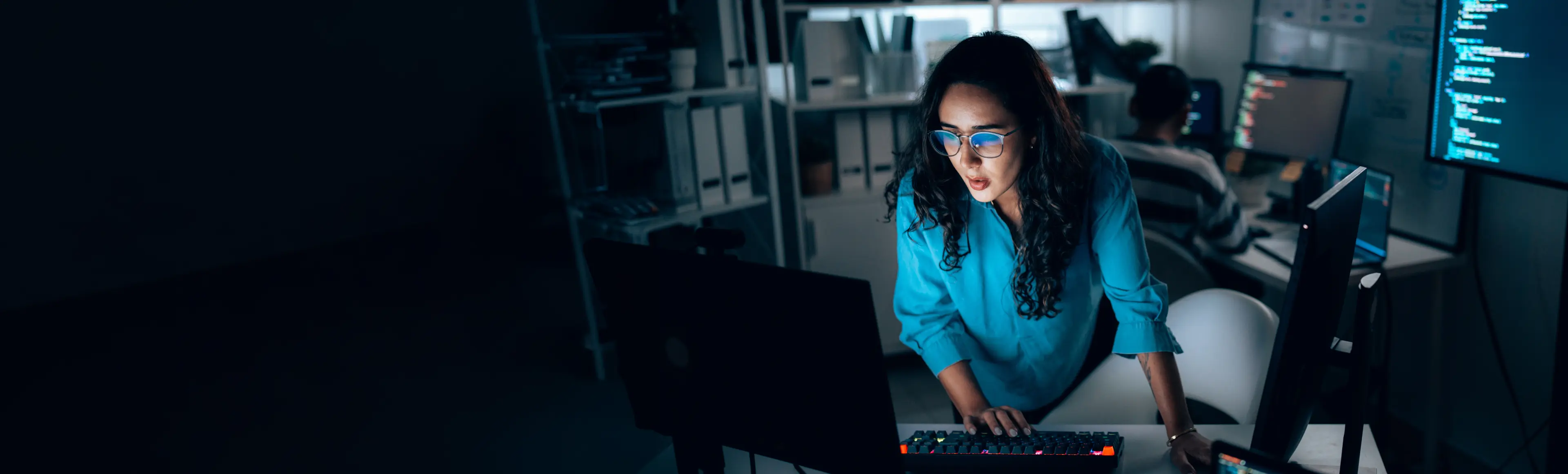 Professional monitoring enterprise AI operations in a technology workspace.