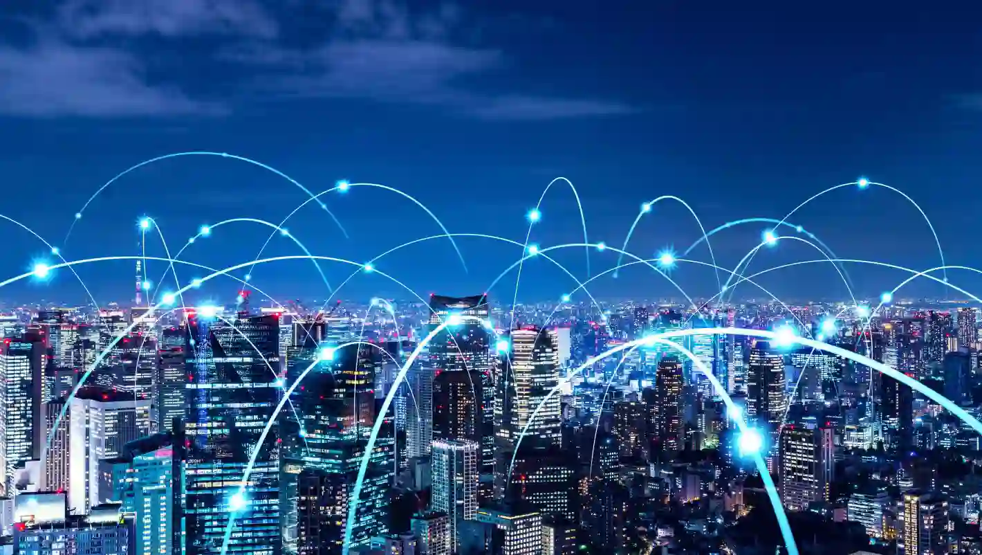 Digital connections across a city skyline illustrating TP’s global network and innovation.