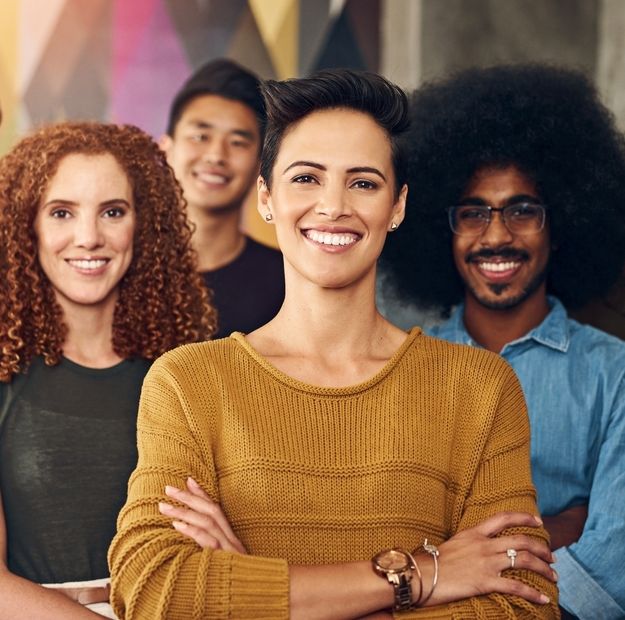 Diverse team collaborating in a vibrant, energetic office, reflecting TP’s spirit in Latin America and its culture of performance.