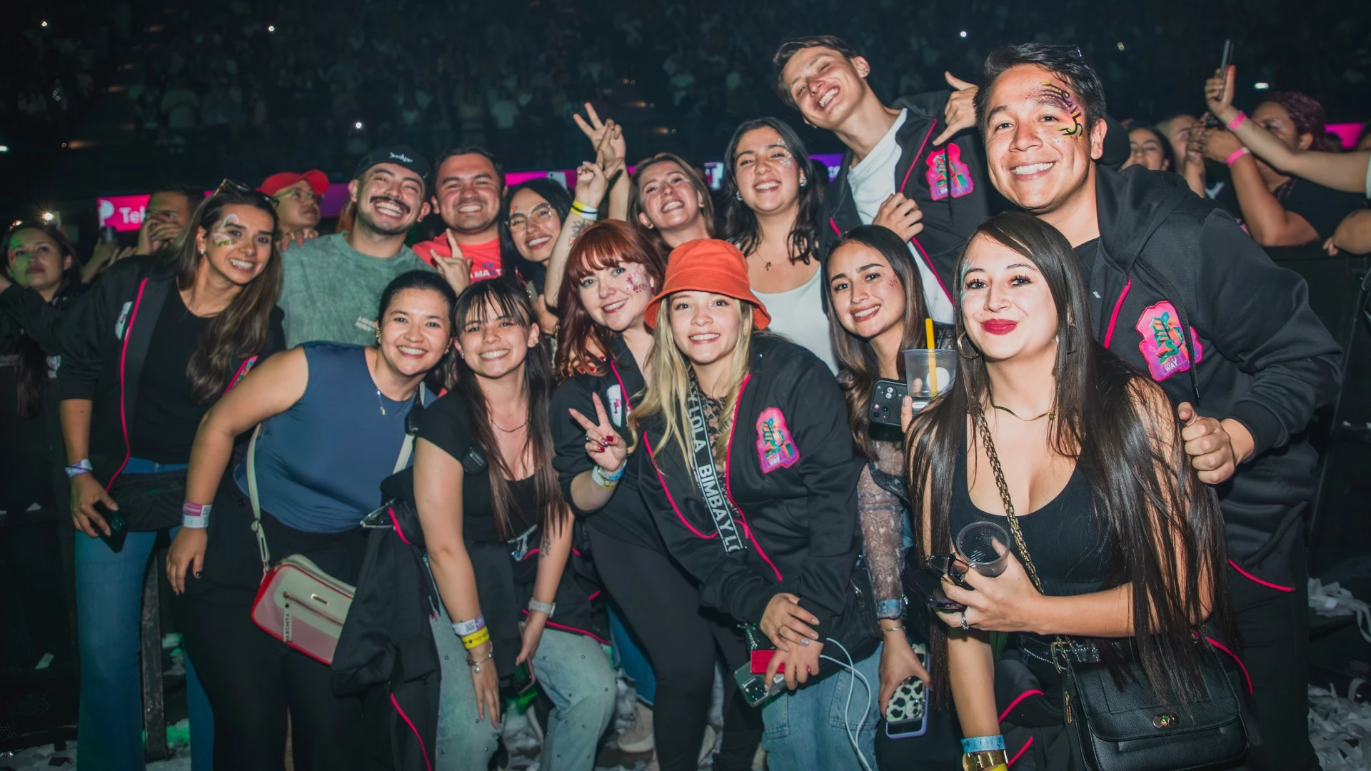 A big group of people posing for a photo in a party.