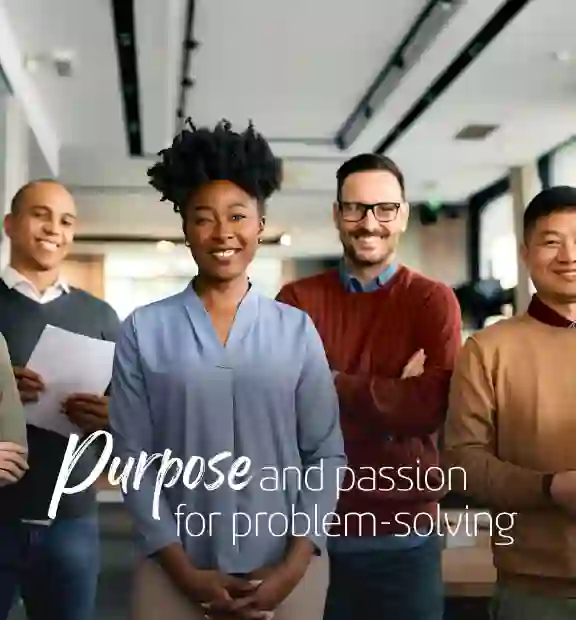 Smiling business people in a modern office staring the camera for a picture