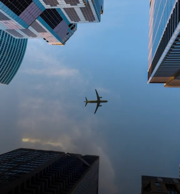 Airplane flying over the city