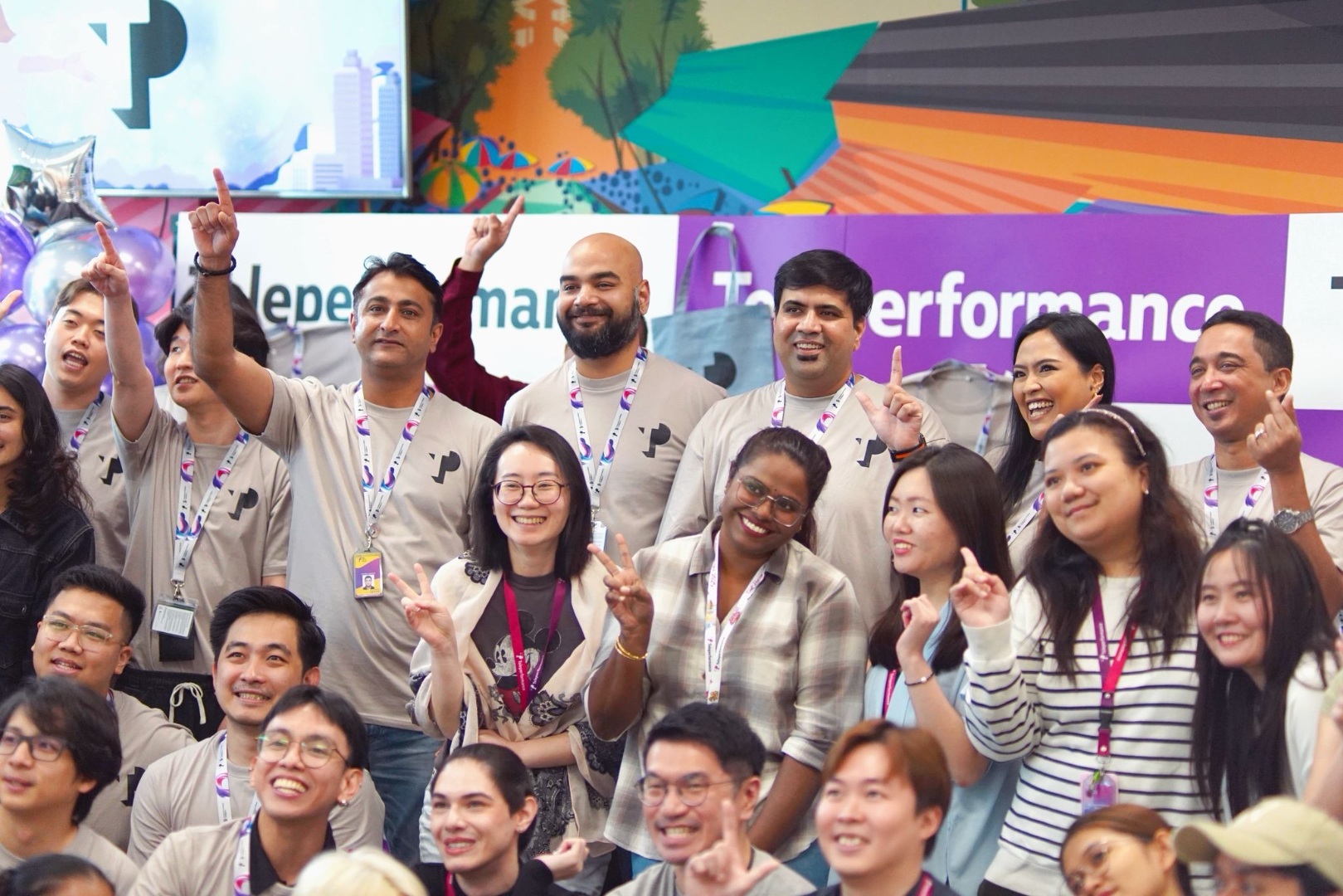 TP employees posing and smiling at company event