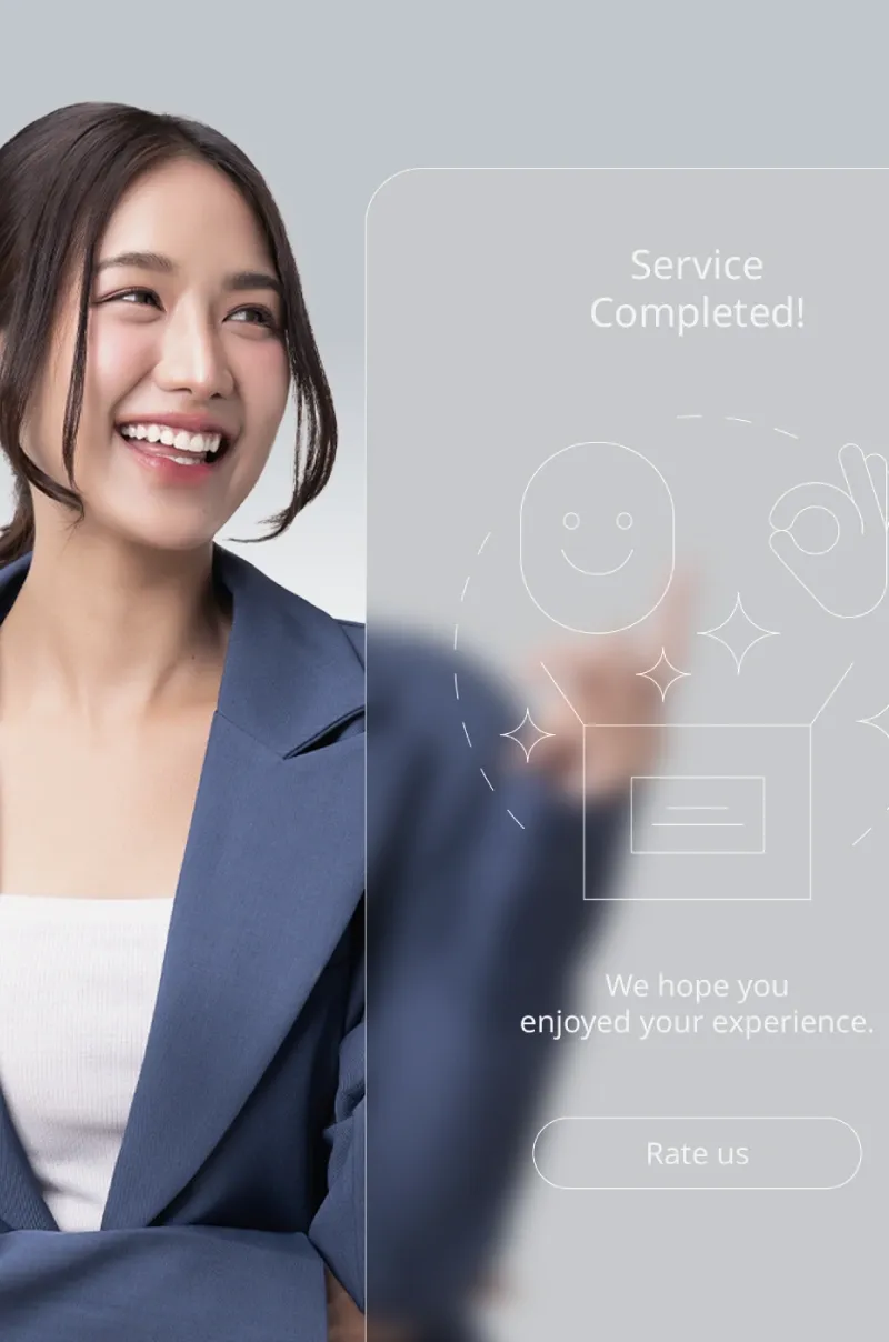 Smiling young executive pointing to a chatbot conversation on screen.