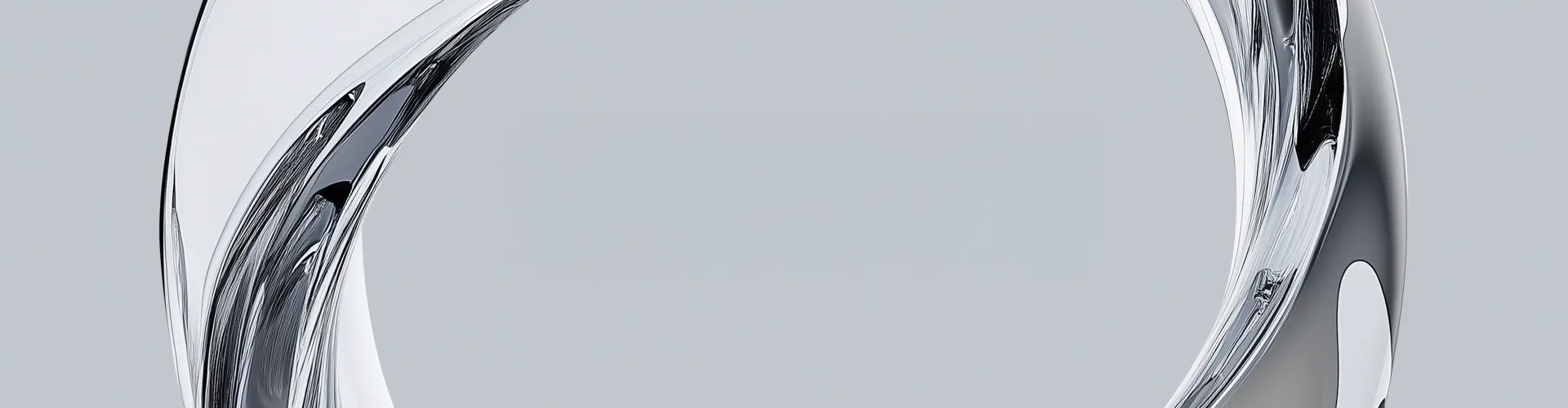 Abstract metallic ring structure surrounding the text 'Creating real business value beyond technology' on a light gray background.