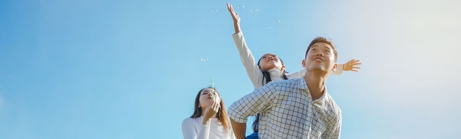 Asian family enjoying outdoors, representing TP’s PR on new carbon emissions targets approved by SBTi.