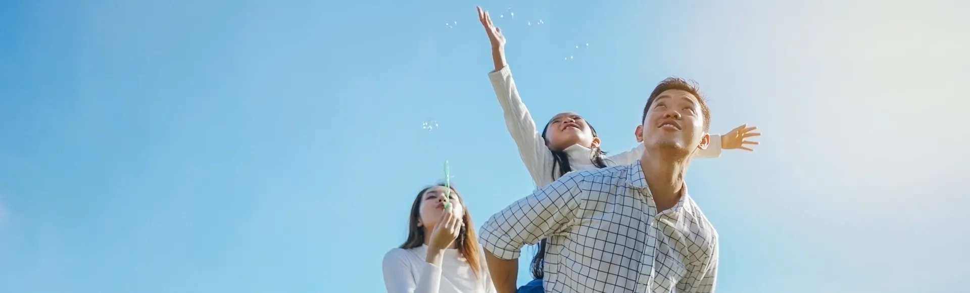 Asian family enjoying outdoors, representing TP’s PR on new carbon emissions targets approved by SBTi.