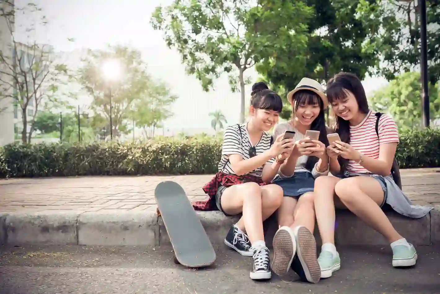 Young people connecting through technology, reflecting TP’s digital engagement.