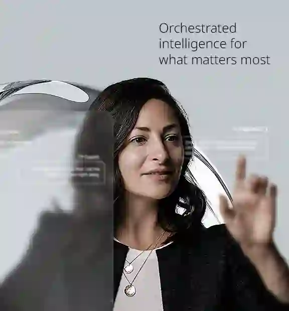 Woman interacting with transparent digital interface displaying AI-generated customer support suggestions, with the text 'Orchestrated intelligence for what matters the most' in the background.