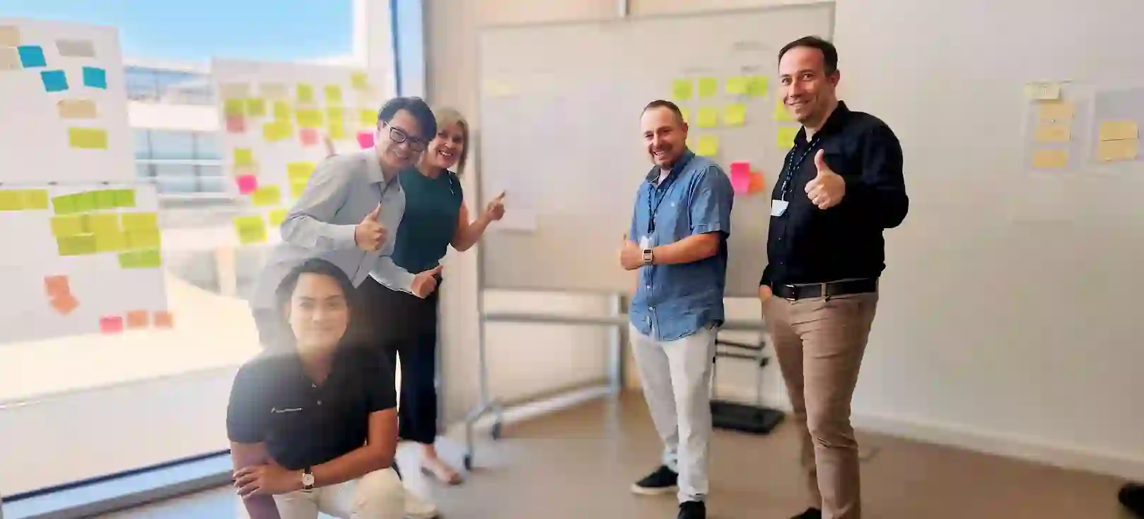 TP employees waving to the camera