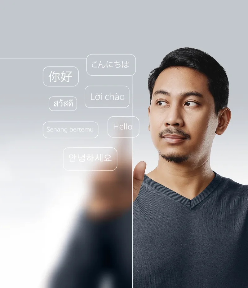 Man interacting with 3D language elements, depicting TP’s Multilingual Hub outsourcing solution.