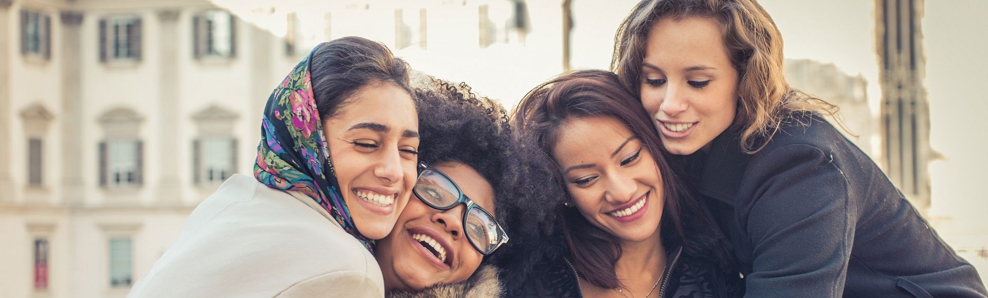 Group of friends hugging each other