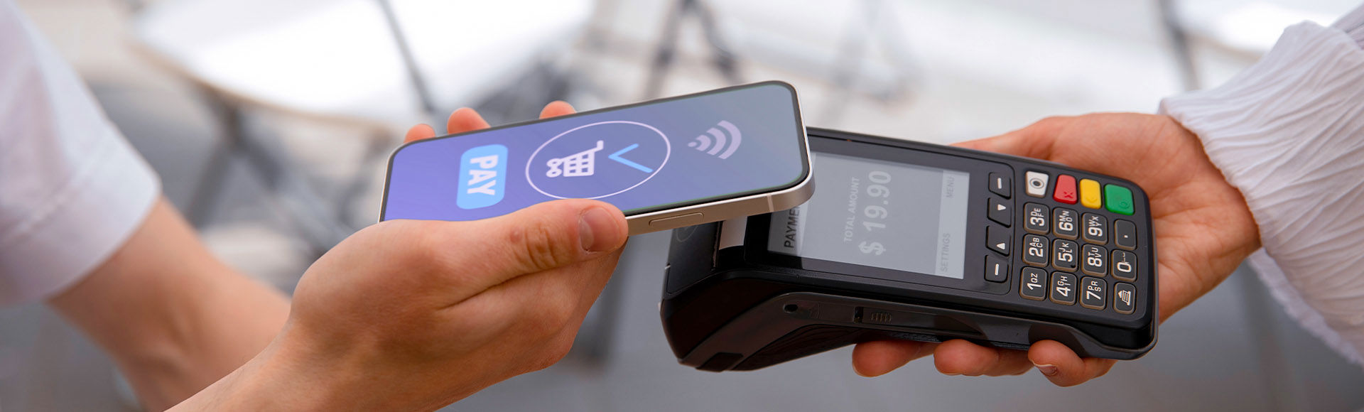 A customer completes a fast contactless mobile payment at a POS terminal.