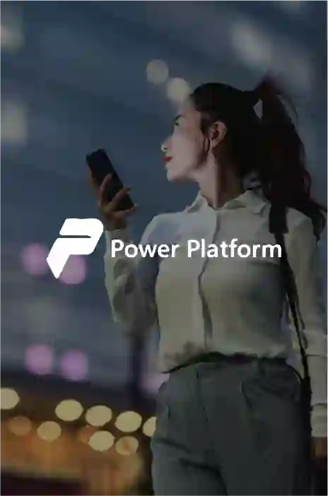 Power platform logo in focus and a woman walking on a bright street holding her cellphone in the background