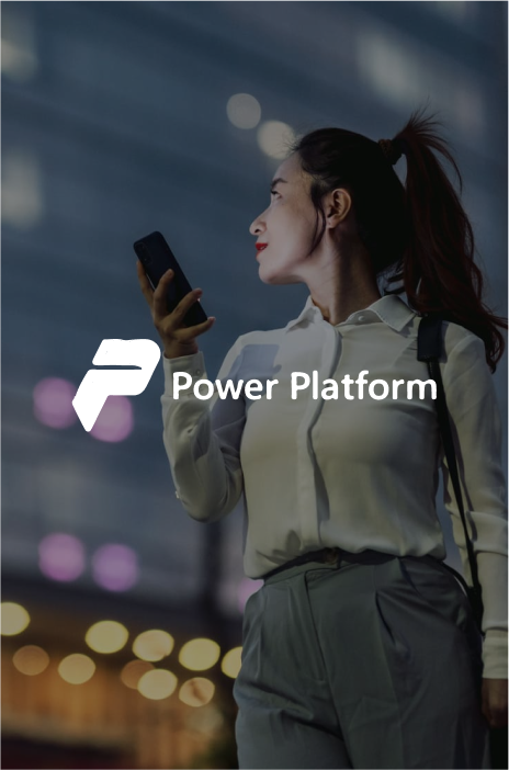 Power platform logo in focus and a woman walking on a bright street holding her cellphone in the background Power platform logo in focus and a woman walking on a bright street holding her cellphone in the background