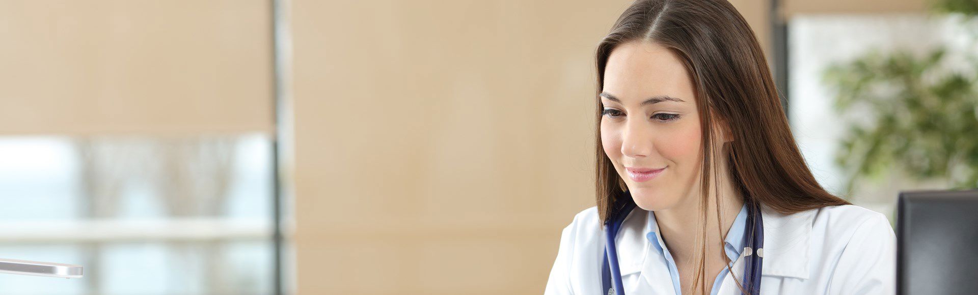 Doctor in a medical office symbolizing TP’s commitment to employee safety during COVID-19.