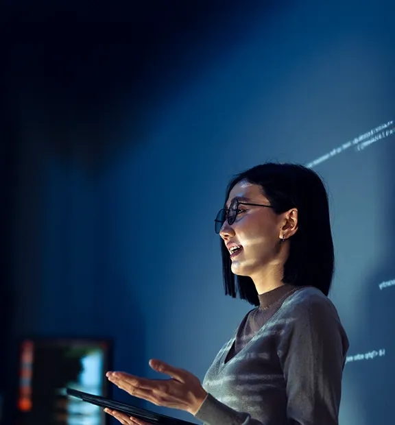 Asian businesswoman speaking, representing innovative experiences and AI insights.