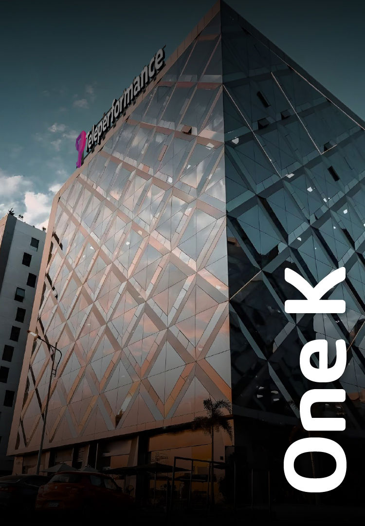 TP building in Egypt with a mirrored glass facade and palm trees in front. TP building in Egypt with a mirrored glass facade and palm trees in front.