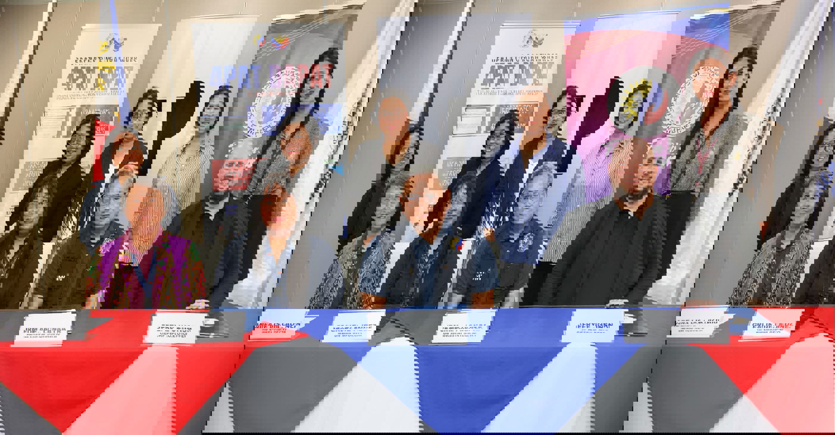 TP and DMW leaders sign MOA for OFW reintegration and anti-trafficking efforts, joined by representatives promoting compassion, inclusivity, and community support. TP and DMW leaders sign MOA for OFW reintegration and anti-trafficking efforts, joined by representatives promoting compassion, inclusivity, and community support.