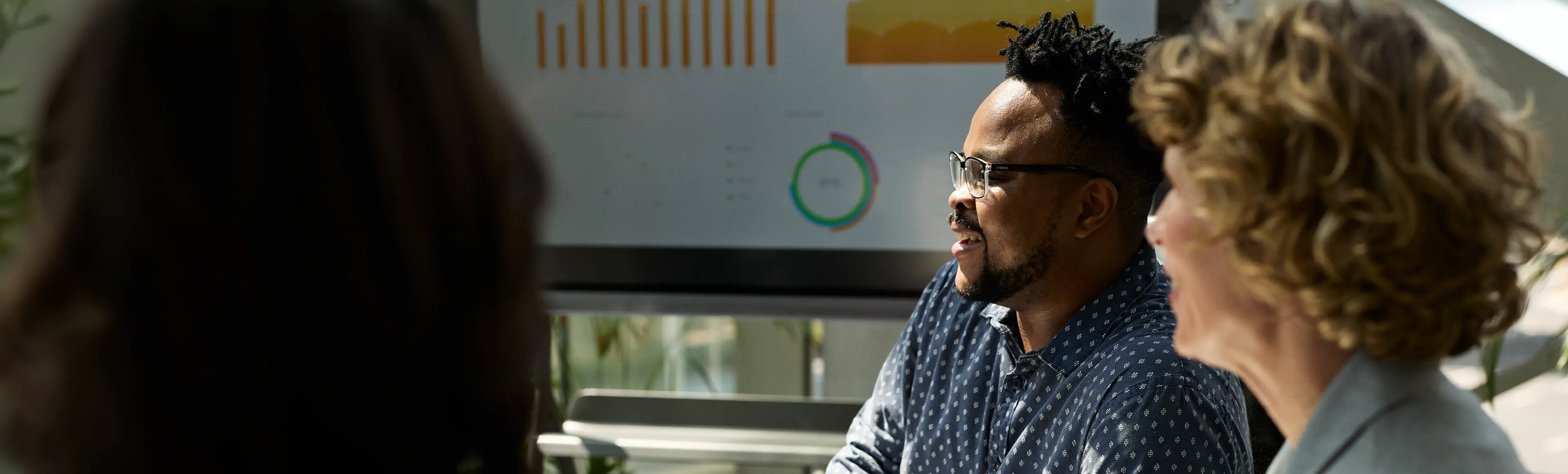 Business team reviews sales performance data to drive scalable B2B growth.