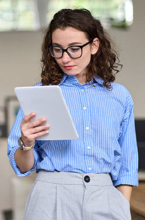 Young business woman reading on her tablet