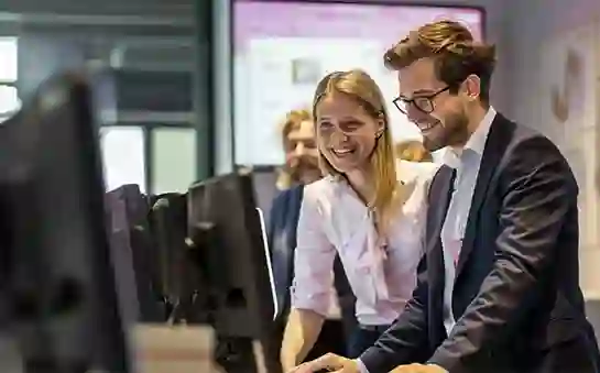 Couple browsing computer during an event