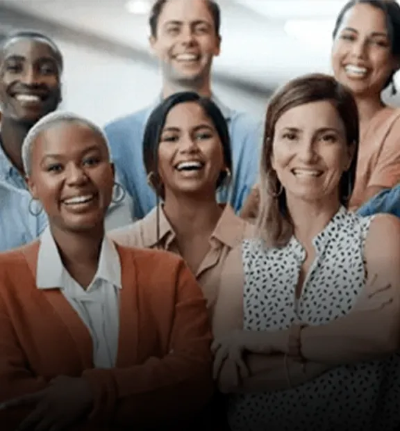 Smiling coworkers looking at the the camera while working in a modern office
