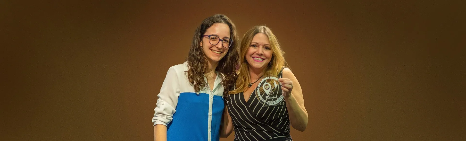 Women holding trophy