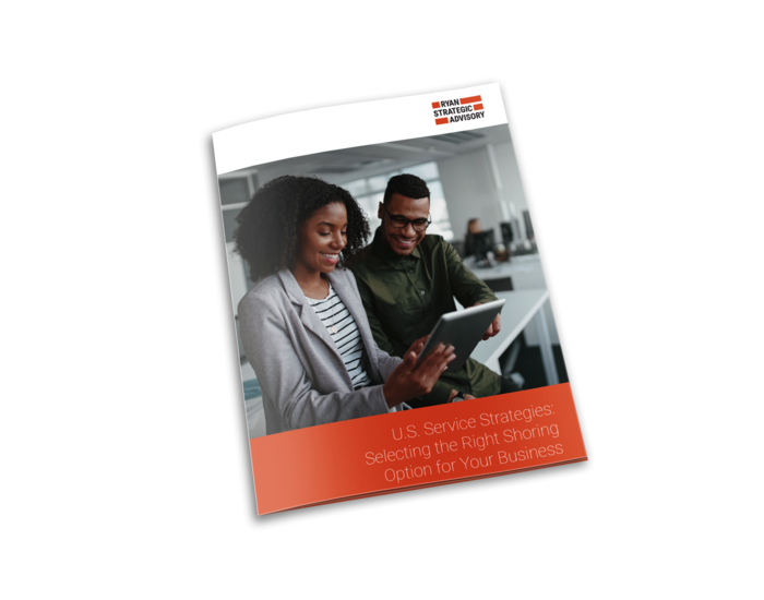 Smiling colleagues working together on a tablet in a modern office, representing TP’s white paper on shoring options.