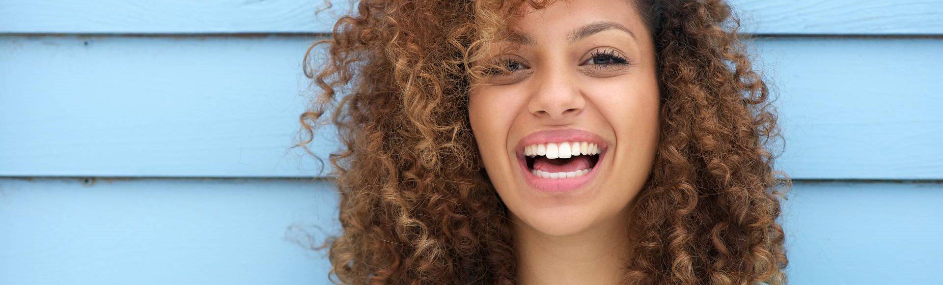 Smiling African TP employee celebrating TP Best Place To Work in Madagascar