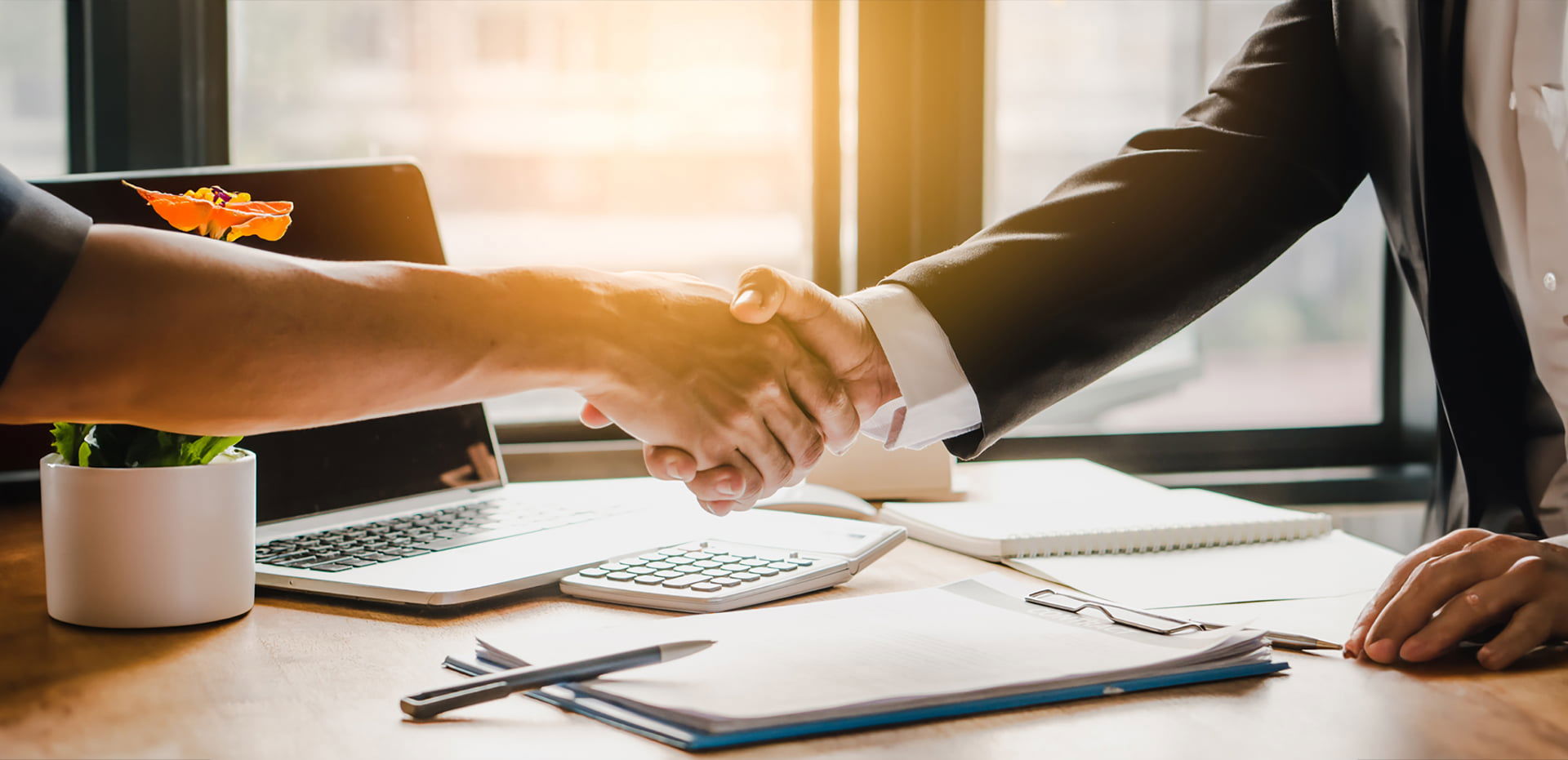 Two businesspeople shaking hands as a sign of a closed agreement, representing TP’s commitment to partnerships. Two businesspeople shaking hands as a sign of a closed agreement, representing TP’s commitment to partnerships.