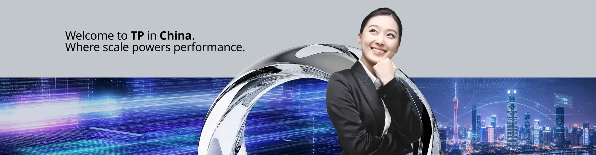 A woman rested her chin in her hand and smiled, looking upwards, dressed in a suit.