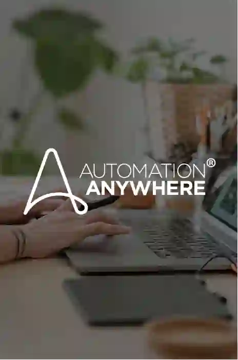 Automation Anywhere logo in focus and person typing in the background